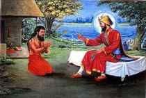 Madho Das being blessed by Guru Gobind Singh Ji after the Birs-his magical forces_were unable to move Guru Ji from the bed which made Madho Das realise the Gurus supreme Godly Powers